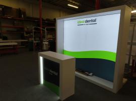 VK-1340 Custom Backlit Inline Exhibit with Fabric Graphic, Monitor Mount, and MOD-1563 Edgelit Counter with Storage